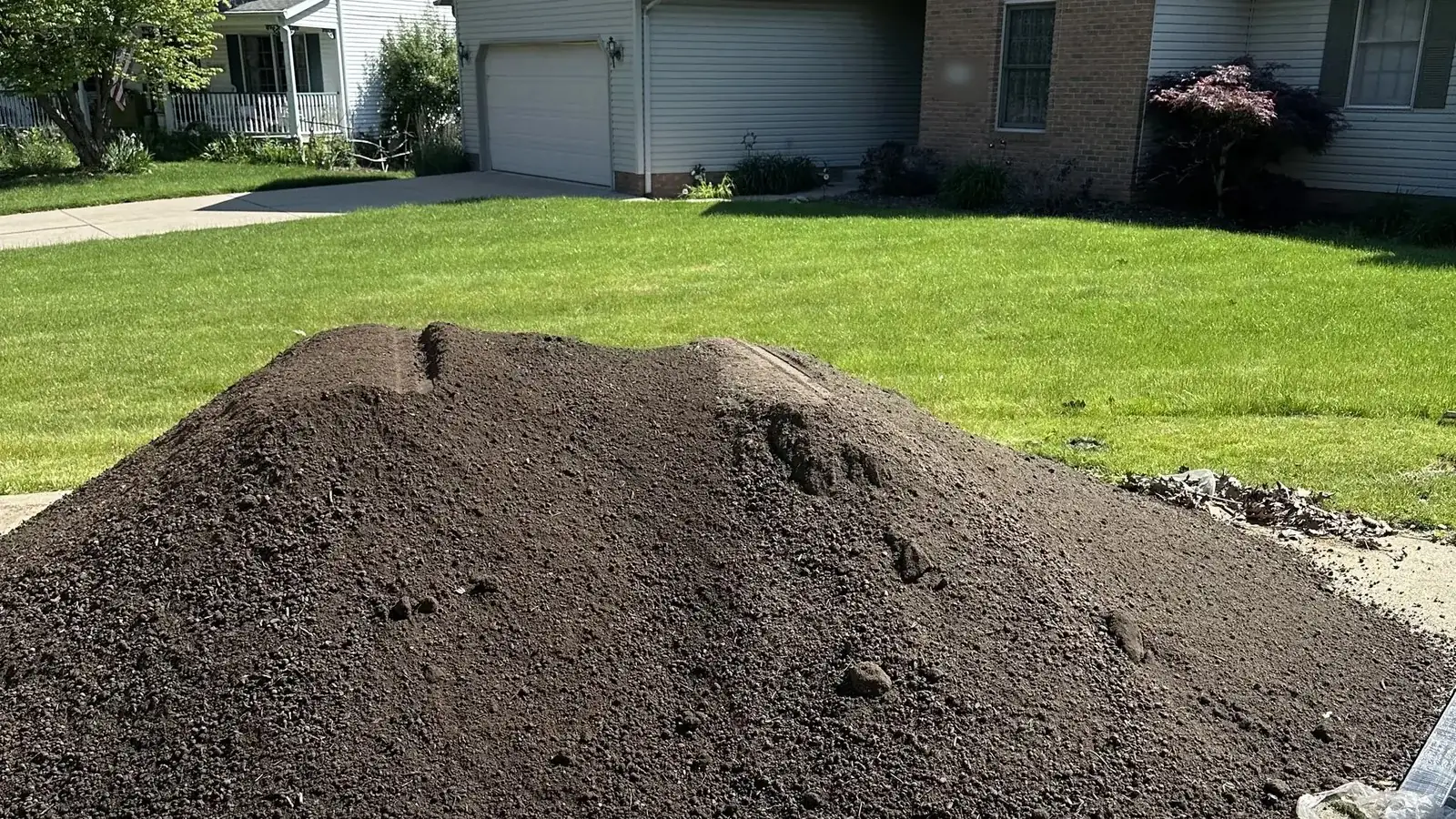 A delivered load of screened topsoil on a driveway in Stow, Ohio